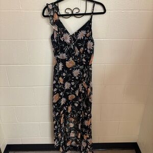 Floral shimmery black dress with V-neck and high-low ruffle skirt